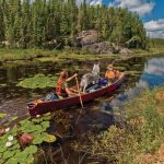 Boat Review: Souris River Quetico 18.5 Canoe Two people on a canoe trip through a lake in the Souris River Quetico 18.5