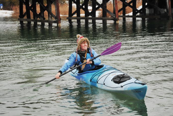 Woman paddling in an Old Town Castine touring kayak