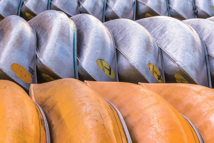 canoes lined up in a two rows