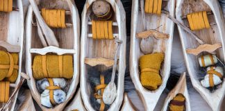 miniature whittled canoes