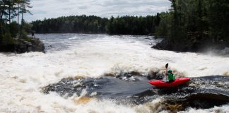 Graham Kent paddling Dagger Kayak's Phantom creek boat down Dragon's Tongue on the Ottawa River