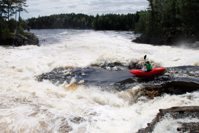 Graham Kent paddling Dagger Kayak's Phantom creek boat down Dragon's Tongue on the Ottawa River