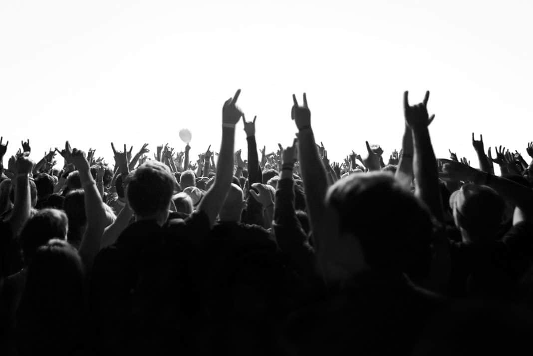 hands in the air with rock and roll symbol