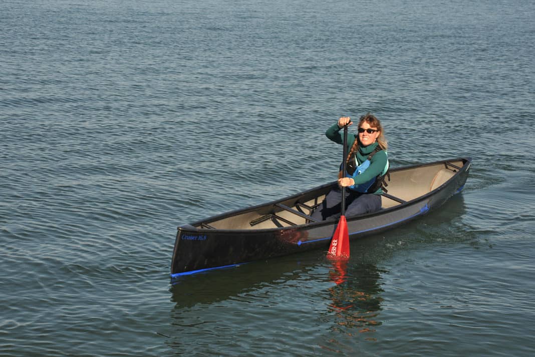 woman paddling in a swift cruiser 16.8 solo canoe