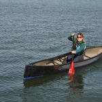 Boat Review: Swift Canoe’s Cruiser 16.8 Solo Canoe woman paddling in a swift cruiser 16.8 solo canoe