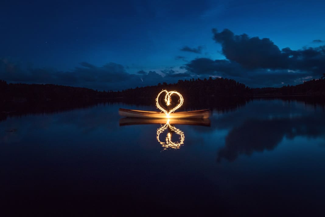 a heart made by light from a canoe