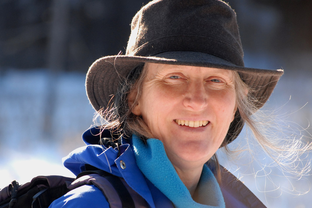 woman with a hat smiling