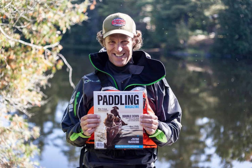Scott MacGregor holding paddling magazine