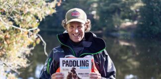 Scott MacGregor holding paddling magazine