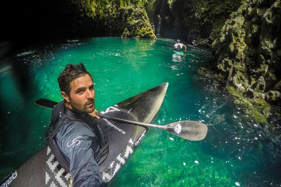 kayaker in emerald water