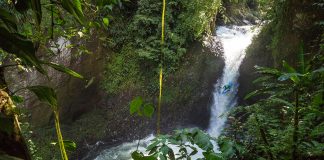 Dropping a waterfall while whitewater kayaking in Mexico