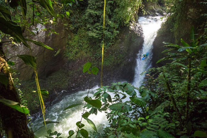 Dropping a waterfall while whitewater kayaking in Mexico