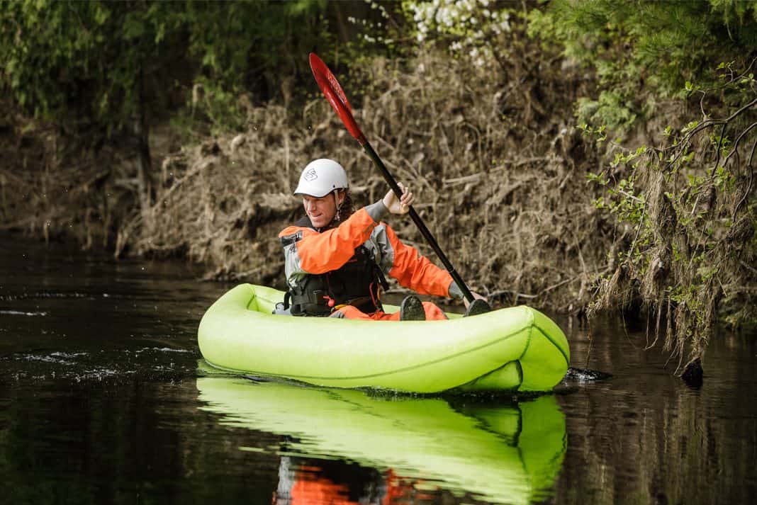 Man paddling the AIRE BAKraft Expedition inflatable packraft