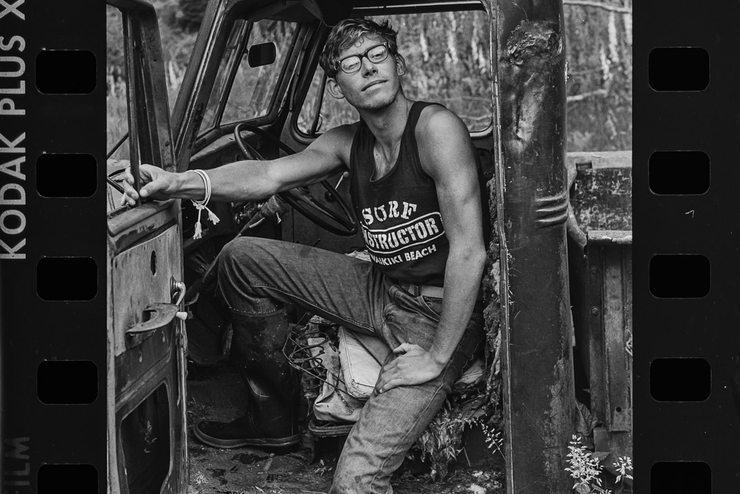 man sitting in an old truck