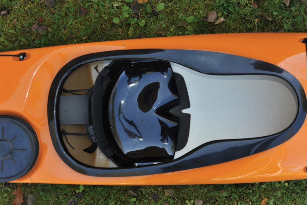 cockpit of an orange sea kayak