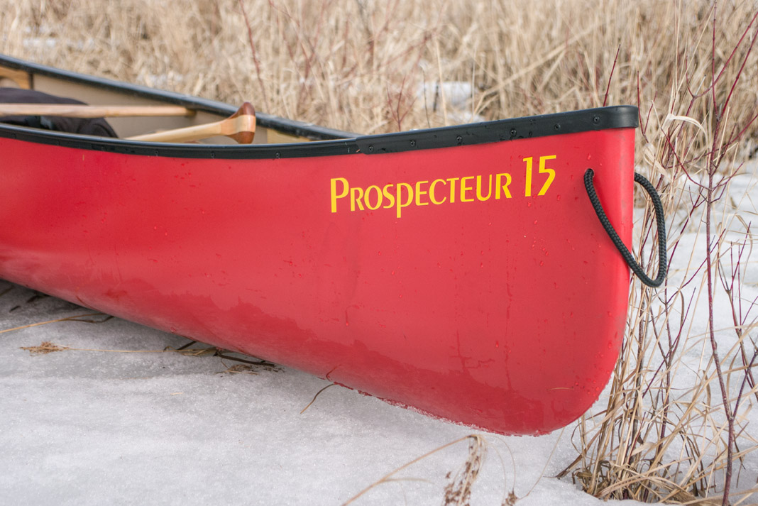 red canoe that says Prospecteur 15 on the bow