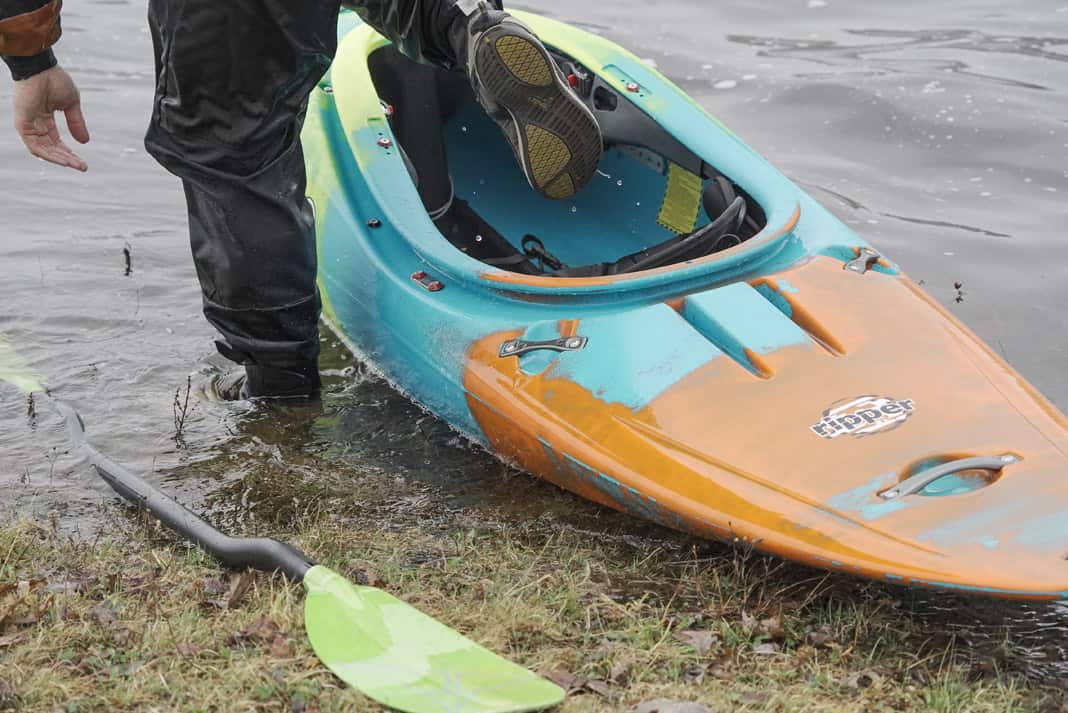 orange and blue Pyranha ripper kayak