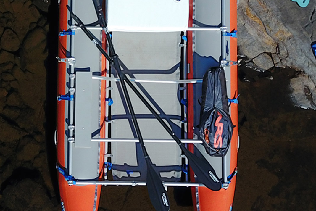 paddles on a raft