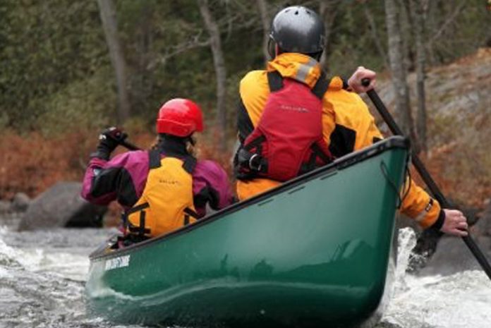 two people canoeing in a Royalex made canoe