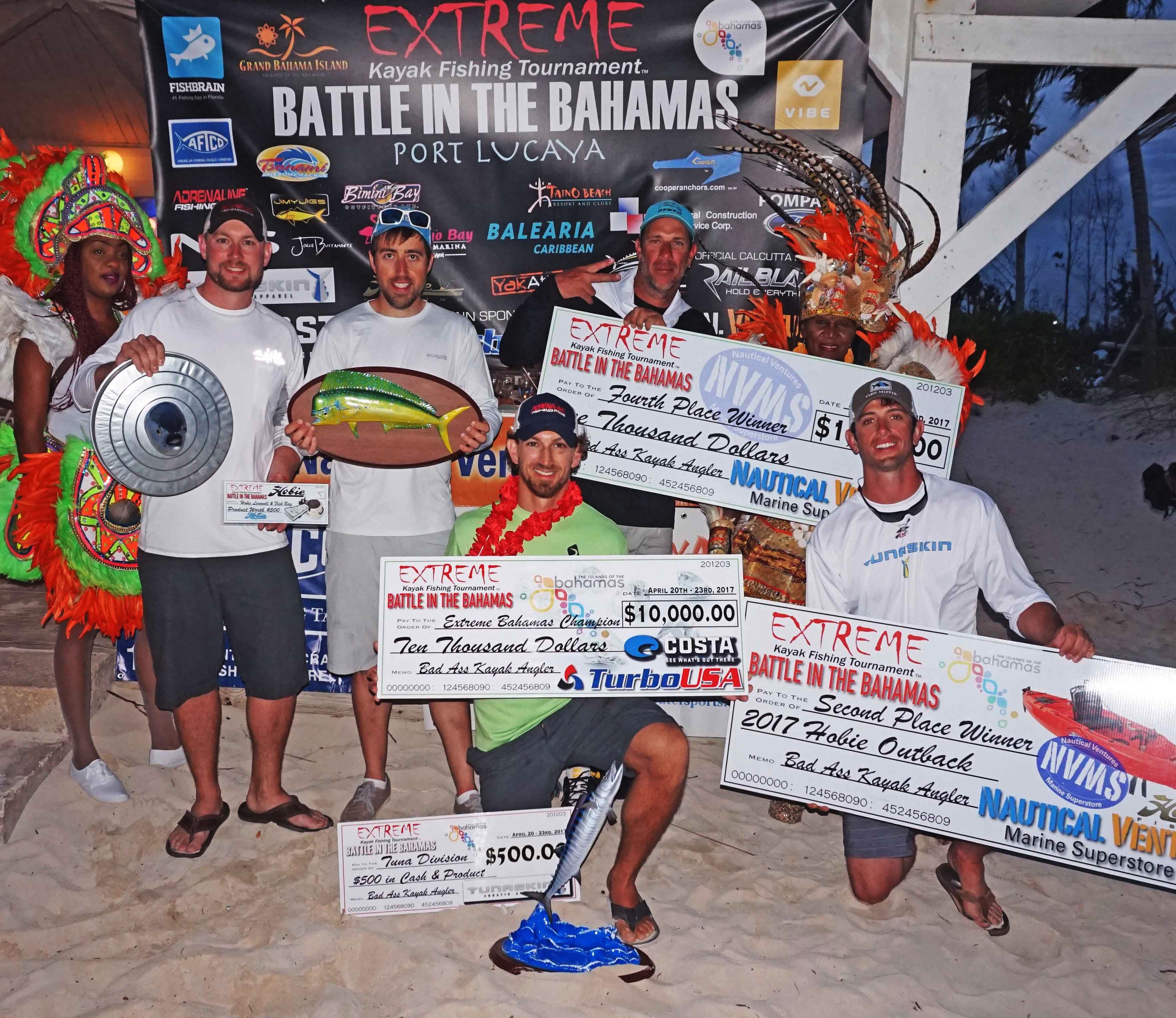The winners of the Extreme Kayak Fishing Battle in the Bahamas pose with their checks. Photo: Extreme Kayak Fishing Tournament