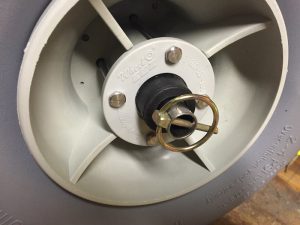 A close image of the quick-release safety pins securing the WheelEez Inflatable Tires to a homemade kayak cart.