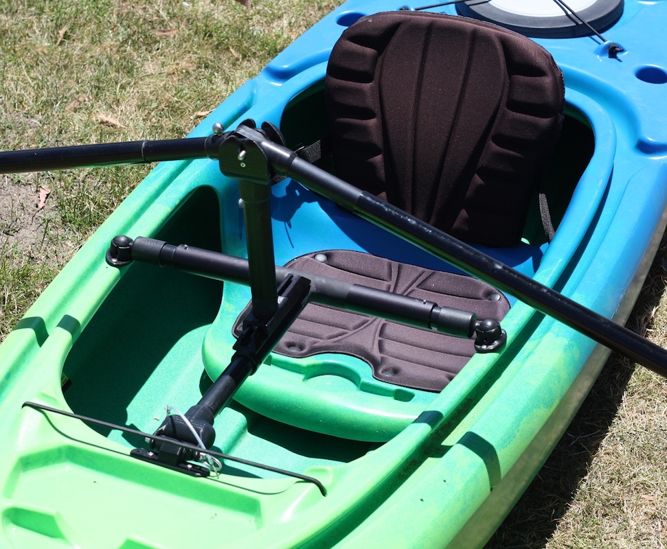 Image of the cockpit of a kayak outfitted with the angle oar adaptive kayak paddle.