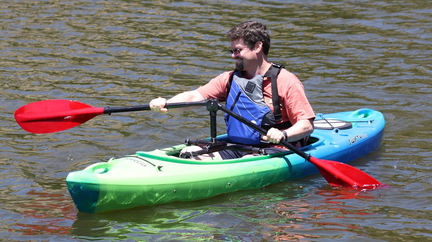 Kayak angler paddles using the Angle Oar adaptive kayak paddle.