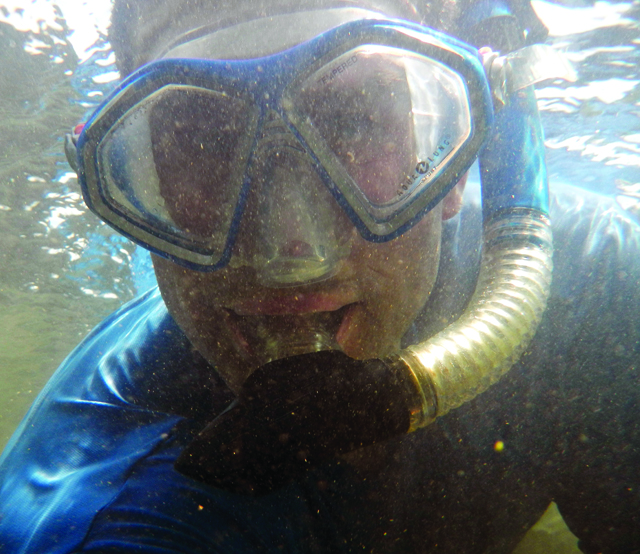 Jeff Little wearing a mask and snorkel under water.