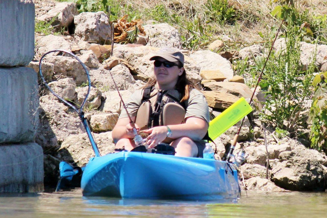 woman fishing from her kayak
