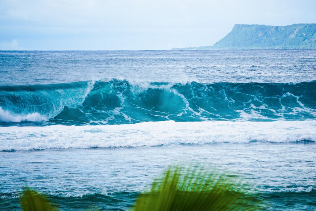 waves break off Guam, a paradies for bluewater kayak fishing