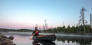 composite canoe on foggy lake