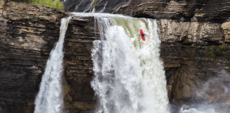 kayak going over waterfall