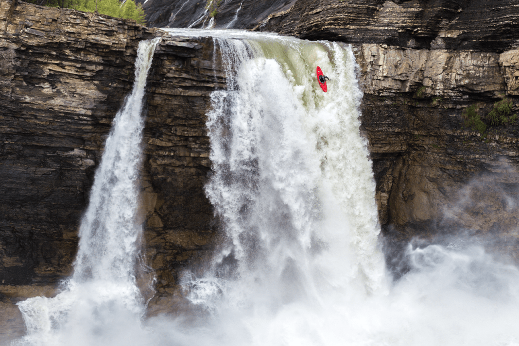 kayak going over waterfall