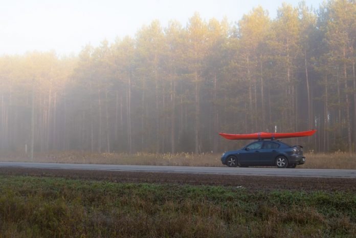 car with kayak on roof