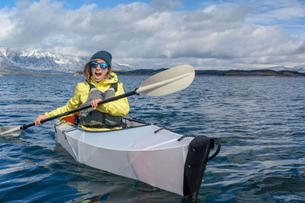 Woman paddling in an Oru Kayak Inlet folding kayak