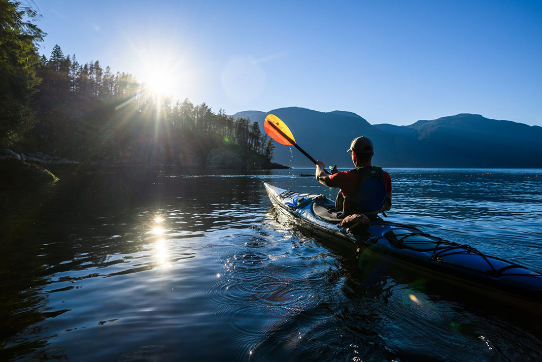 Photo of kayaker with paddle
