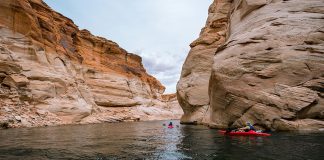 Kayaks with canyon walls on either side