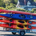Guide To Kayak Trailers: Types, Parts, Towing Tips & More Kayaks on a trailer