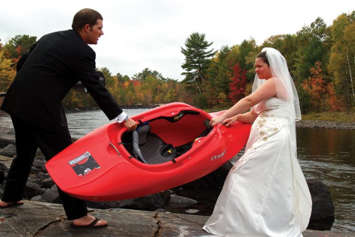 husband and wife fight over a kayak at wedding