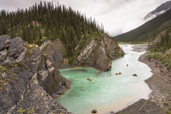 Bend in the Broken Skull River with canoes on it