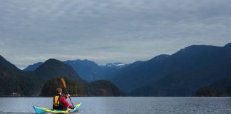 Kayak touring in the Indian Arm fjord near Deep Cove