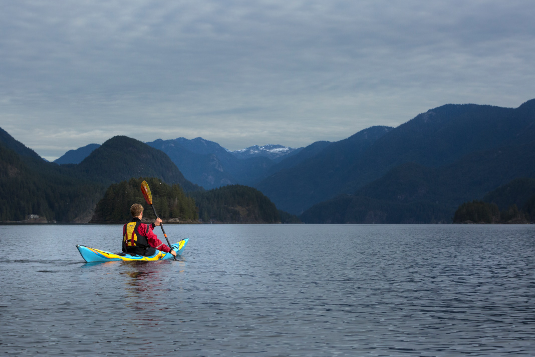 Kayak touring in the Indian Arm fjord near Deep Cove