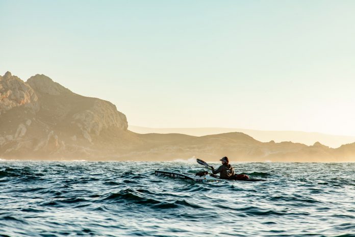 Woman paddling a sea kayak