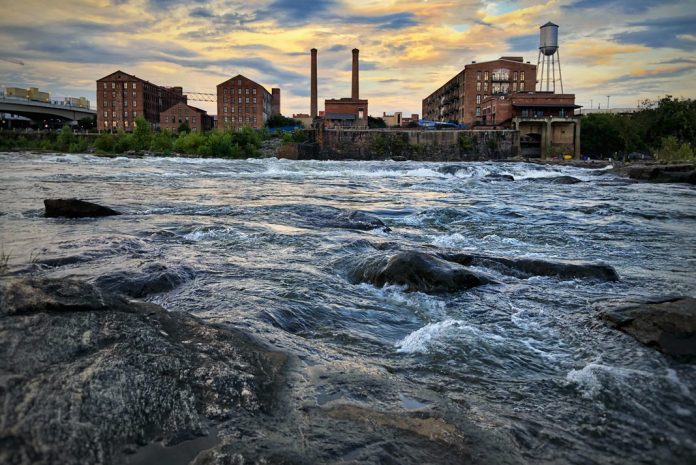 River with factory buildings in background