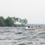 Mike Ranta, sporting his trusty birchbark hat, steers a canoe with Holden Rhodes, owner of Killarney Mountain Lodge, and his family through building seas on route to Killarney. | Photo: David Jackson