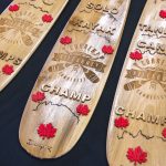 Mike Ranta decorated Badger canoe paddles for the winners. | Photo: David Jackson