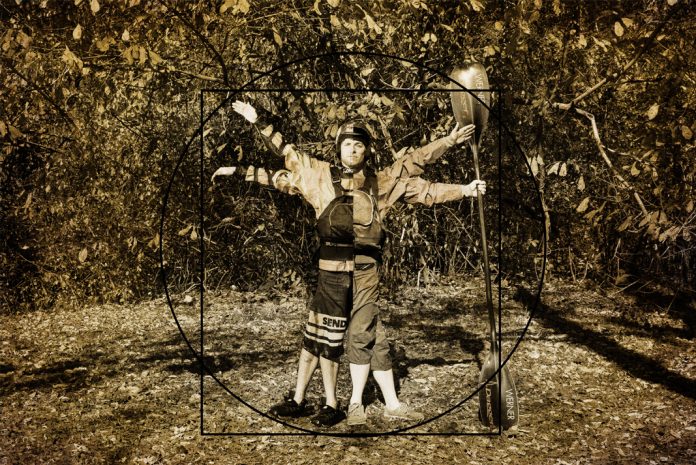 Man decked out in kayaking equipment with arms and legs in different positions.