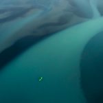 Pro Tips From Photographer Jan Kasl On Getting Your Shots Noticed Photograph of a kayaker paddling glacier runoff.