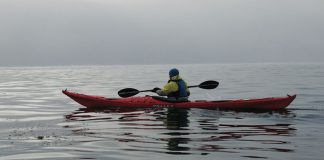 Man paddles in the Valley Nordkapp RM sea kayak