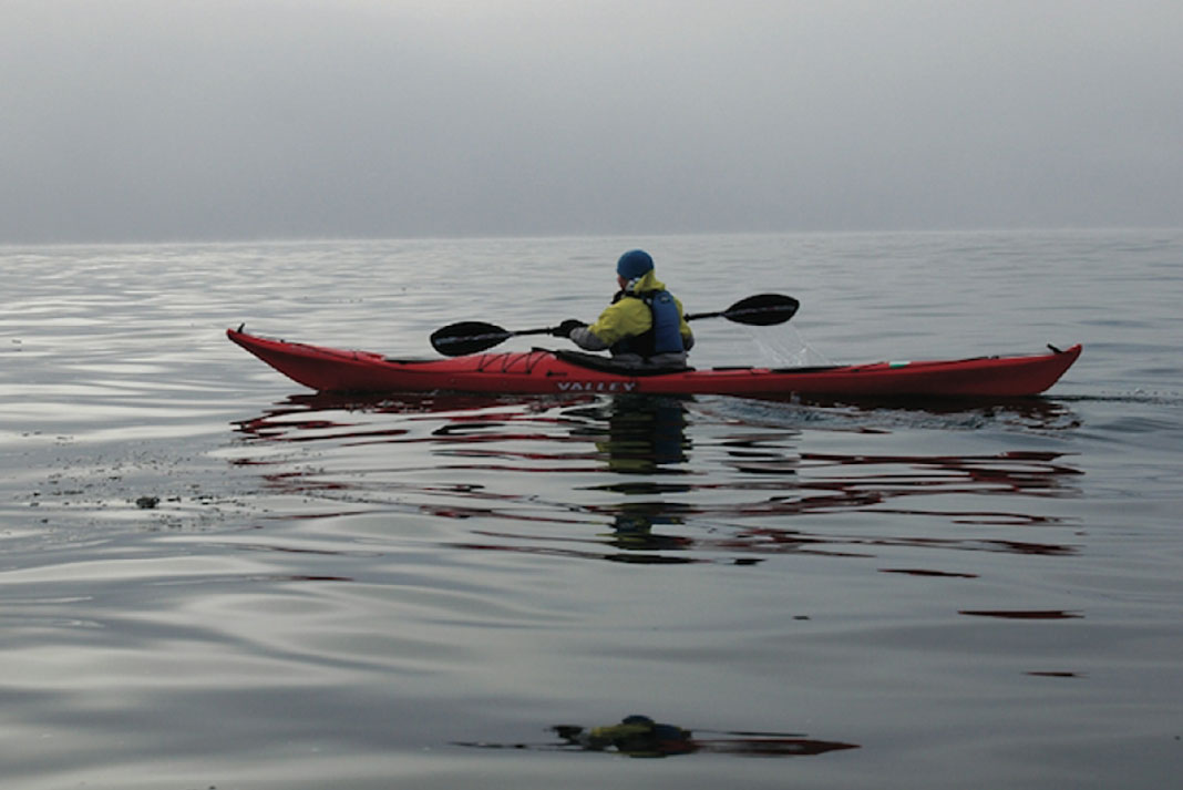 Man paddles in the Valley Nordkapp RM sea kayak